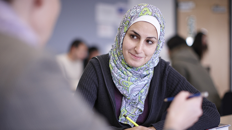Student in headscarf having interview